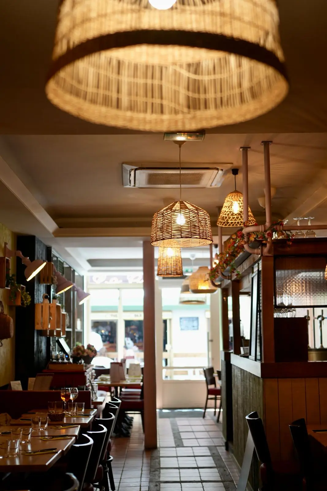 The dining room and its rattan pendant lights